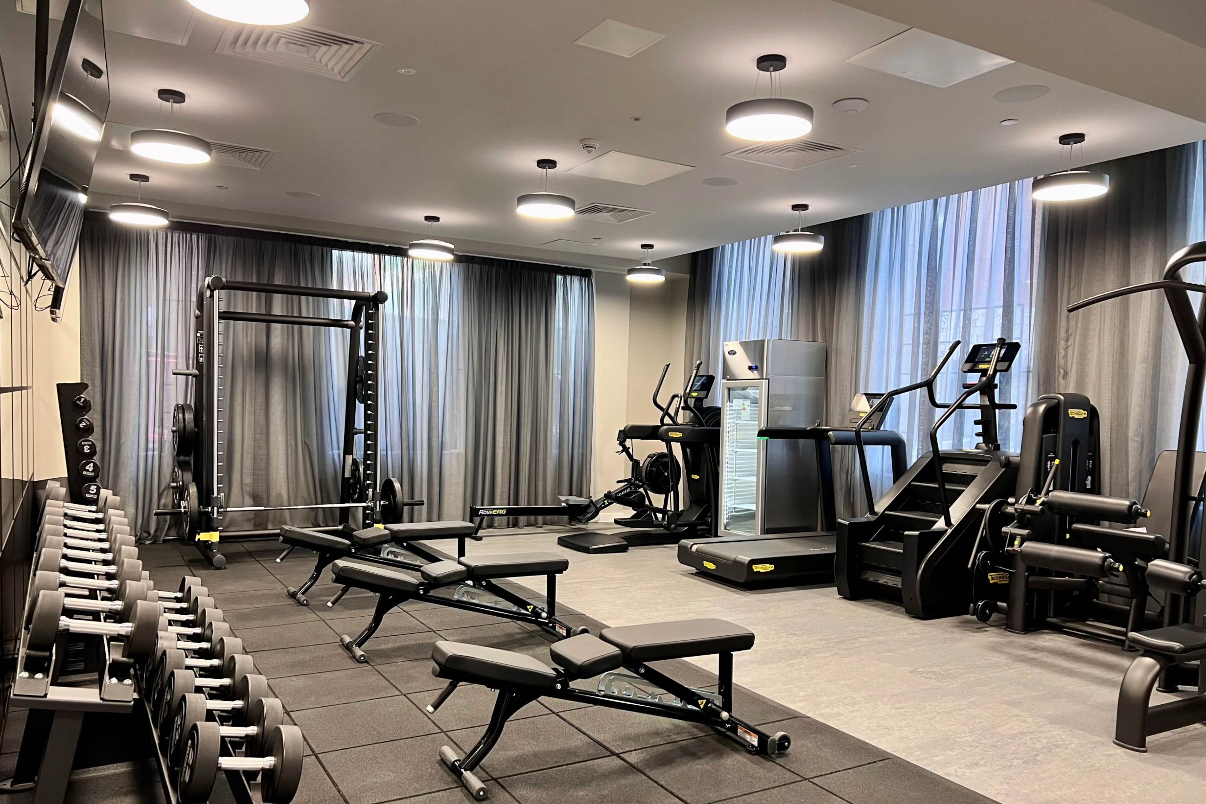 Fully equipped residents’ gym at Landrow Place Birmingham with free weights, machines and cardio equipment.